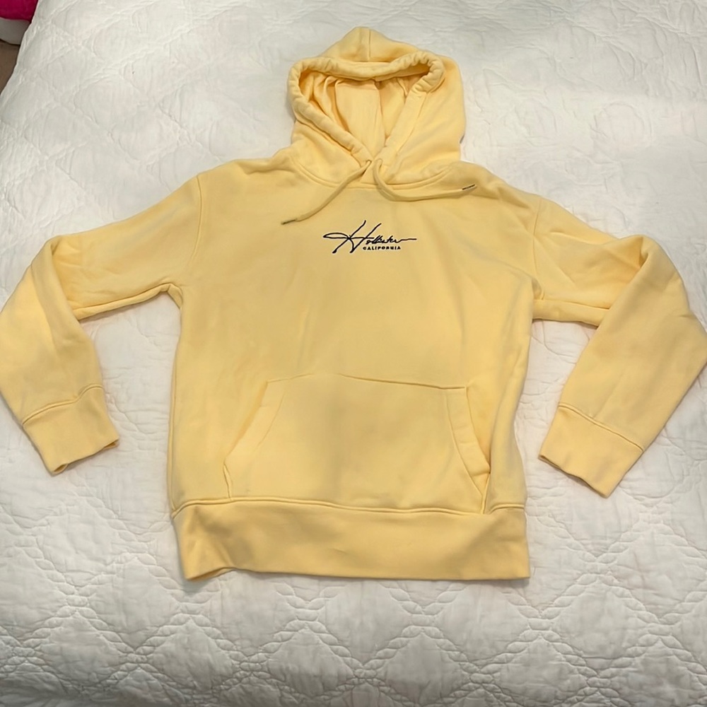 Yellow Hollister hoodie.